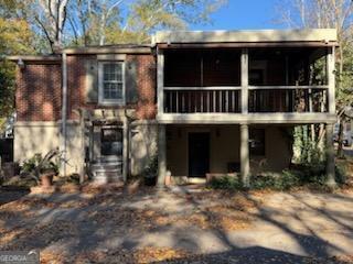 952 Wayside Street Northwest Cornelia, GA 30531 - Photo 43 of 46 a view of a house with a large window and potted plants