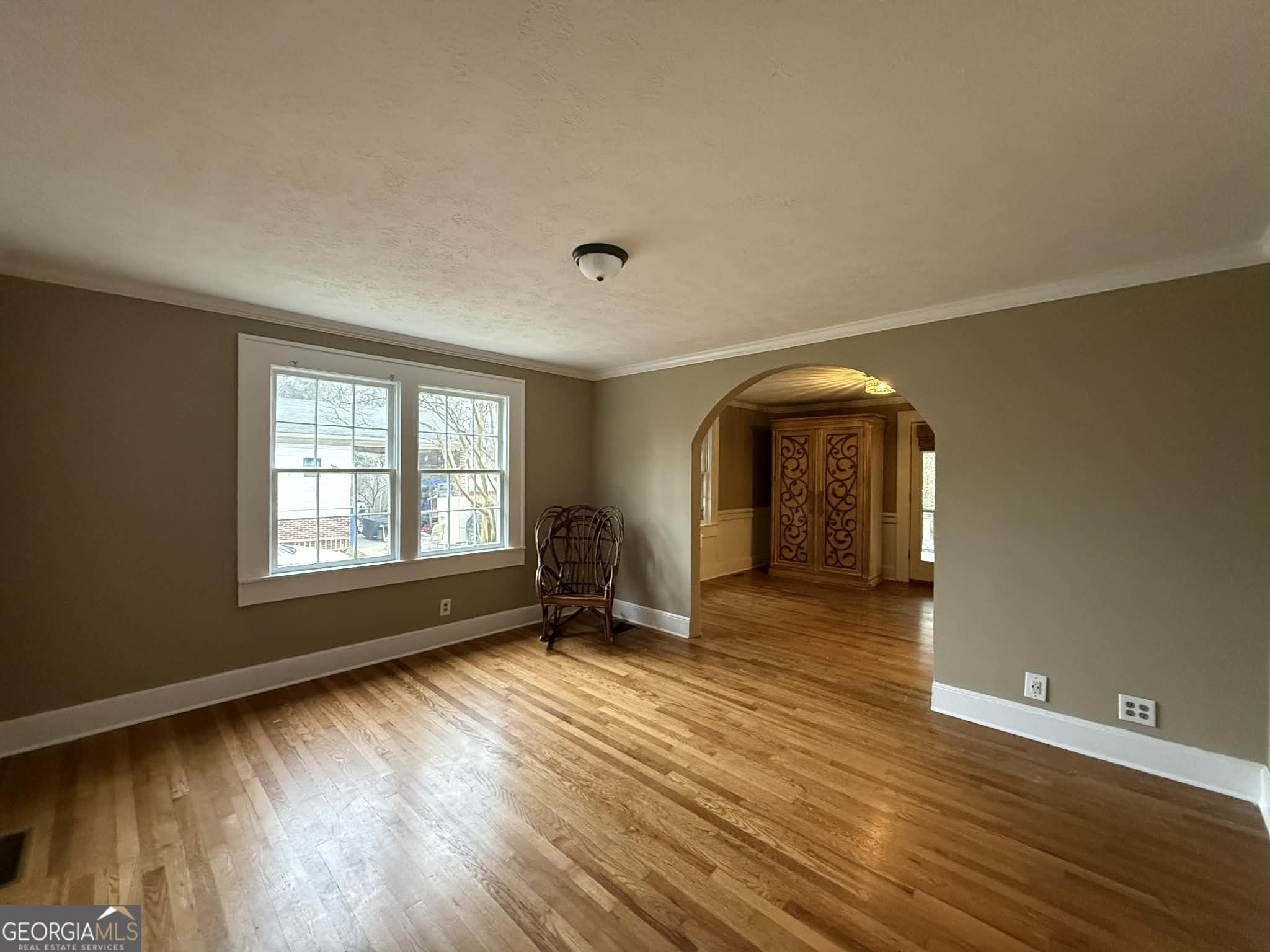 952 Wayside Street Northwest Cornelia, GA 30531 - Photo 7 of 46 a view of an empty room with glass door and wooden floor