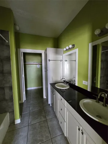 a kitchen with a sink and a refrigerator