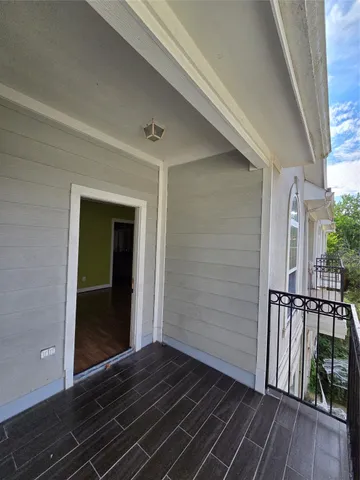 a view of backyard with wooden floor