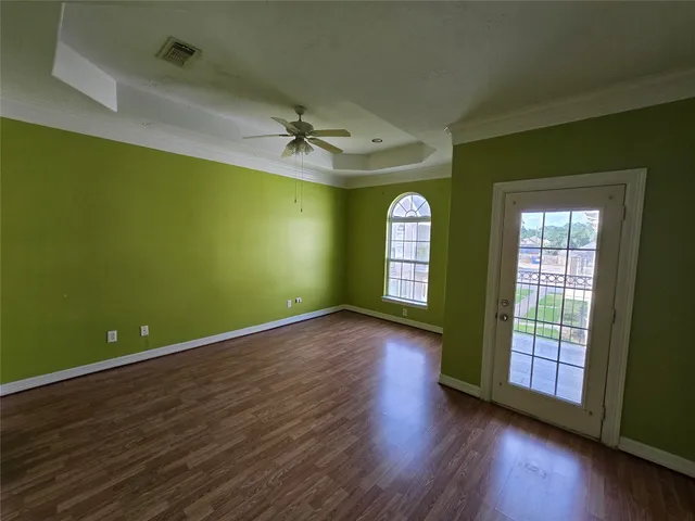 a view of room with window and wooden floor