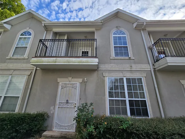 a front view of a house with balcony