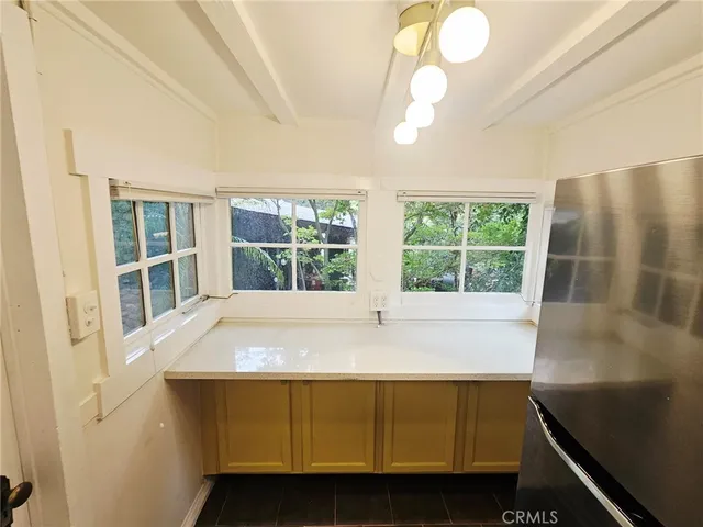 a room with a bed and a large window