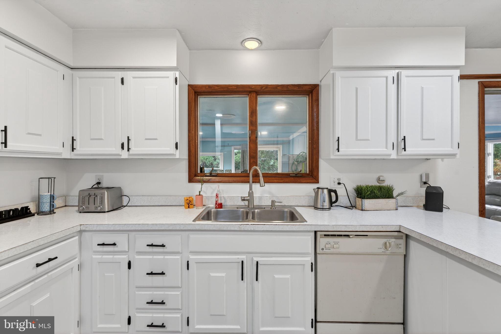 2210 Berkshire Road Lancaster, PA 17603 - Photo 11 of 68 a kitchen with white cabinets and a sink