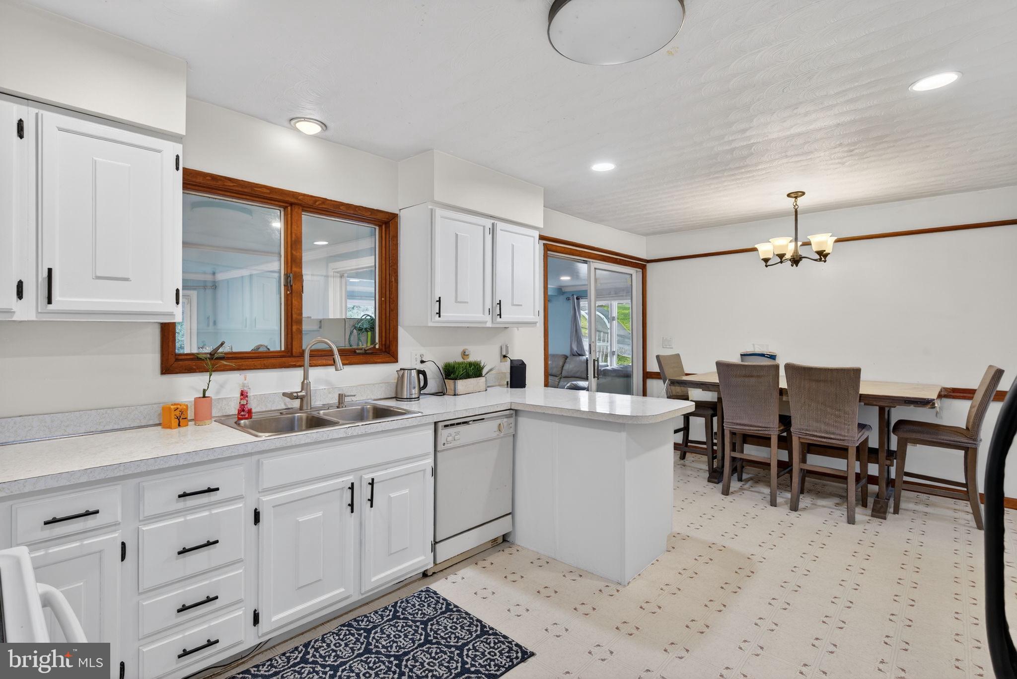 2210 Berkshire Road Lancaster, PA 17603 - Photo 13 of 68 a kitchen with a sink stove and cabinets