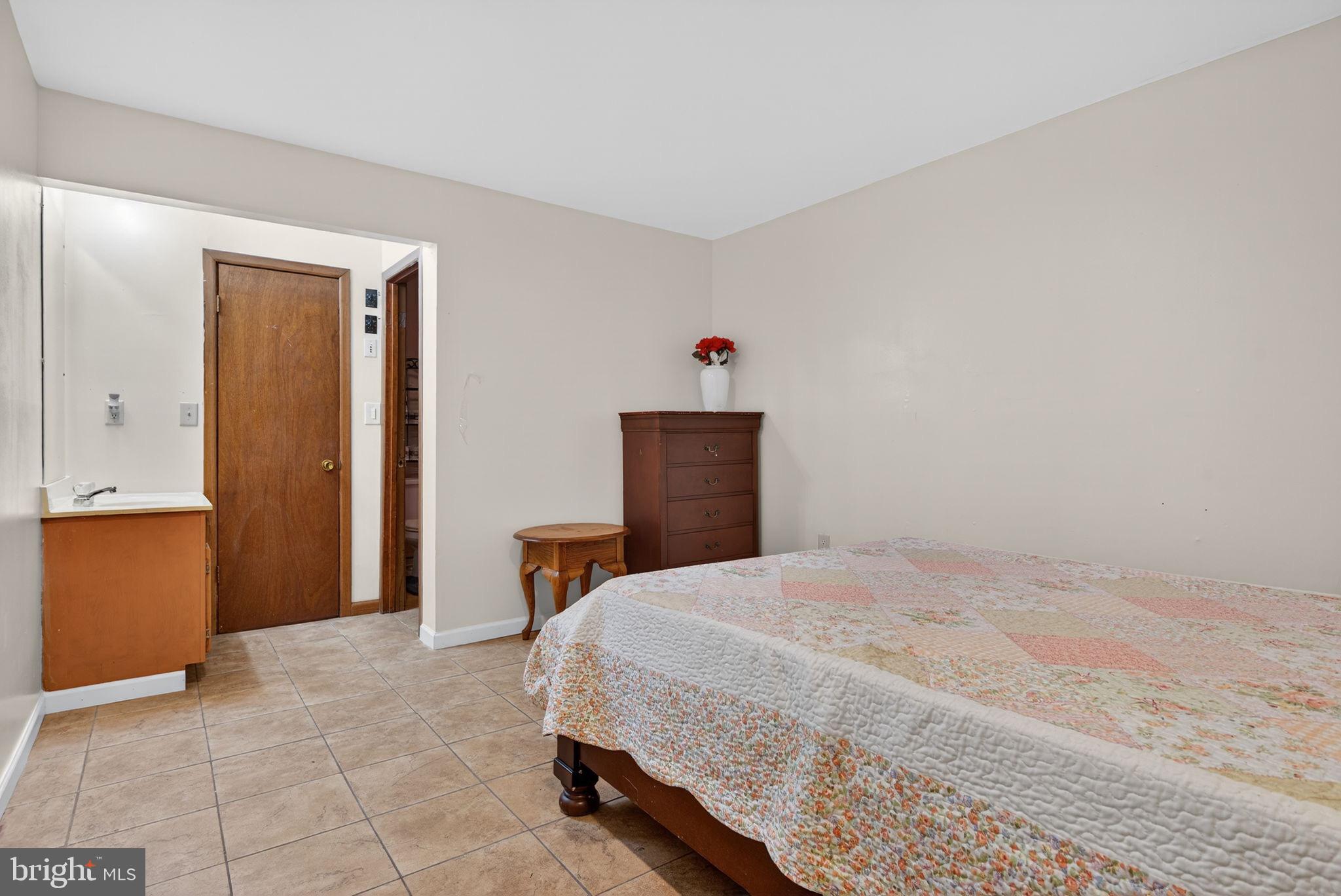 2210 Berkshire Road Lancaster, PA 17603 - Photo 30 of 68 a bedroom with a bed and a table in it