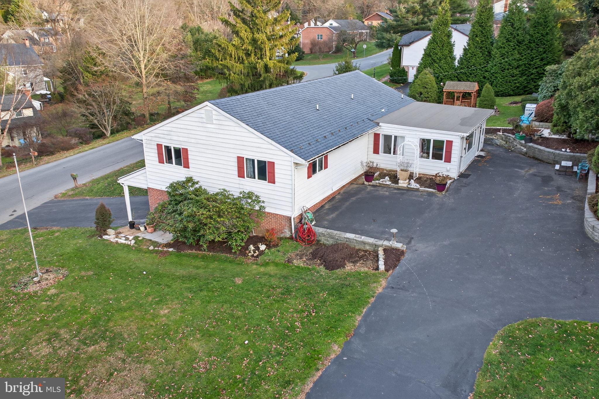 2210 Berkshire Road Lancaster, PA 17603 - Photo 3 of 68 a aerial view of a house next to a big yard and large trees