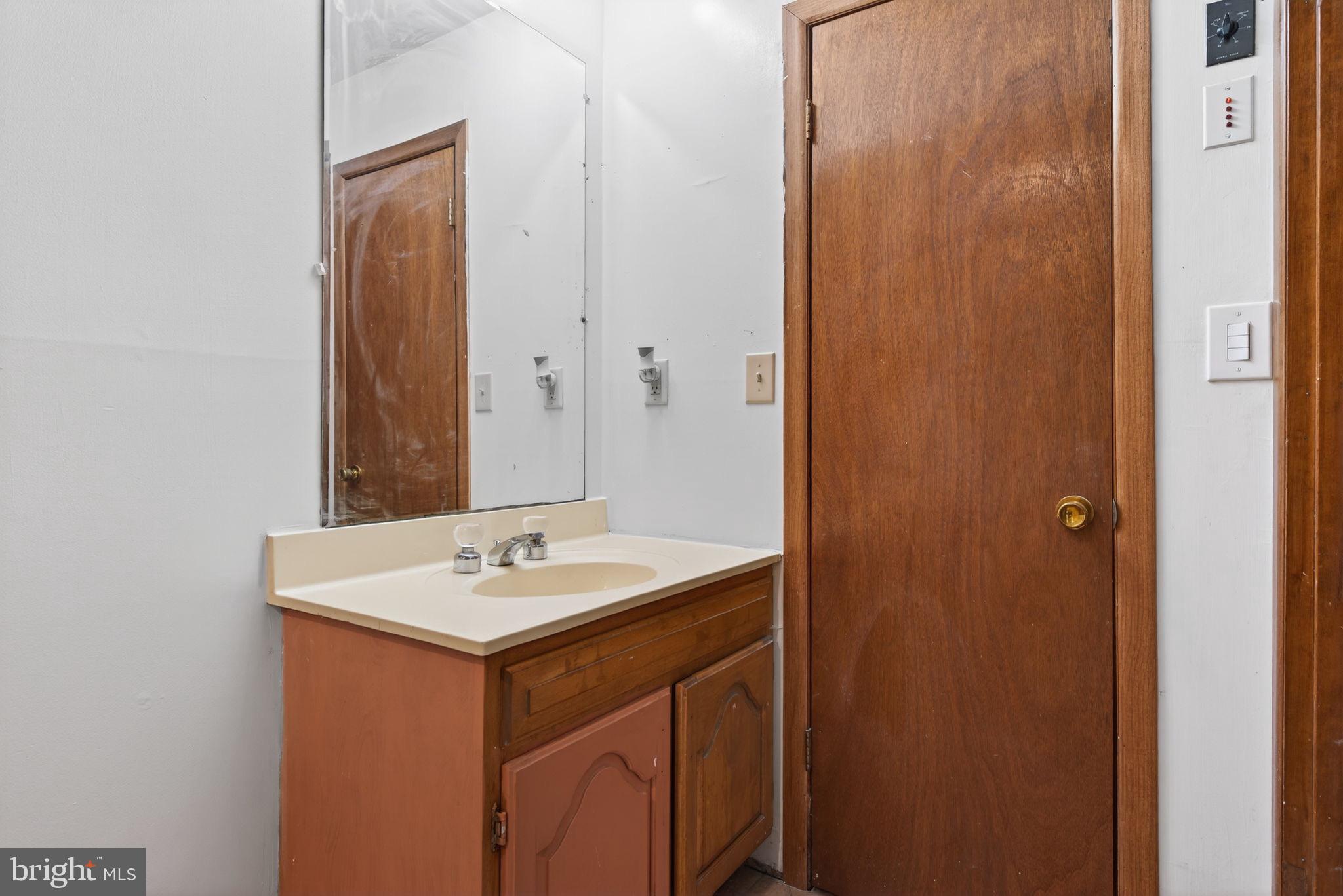 2210 Berkshire Road Lancaster, PA 17603 - Photo 33 of 68 a bathroom with a sink and a mirror