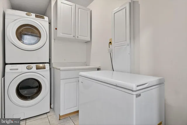 an aerial view of a house with a garden and lake view