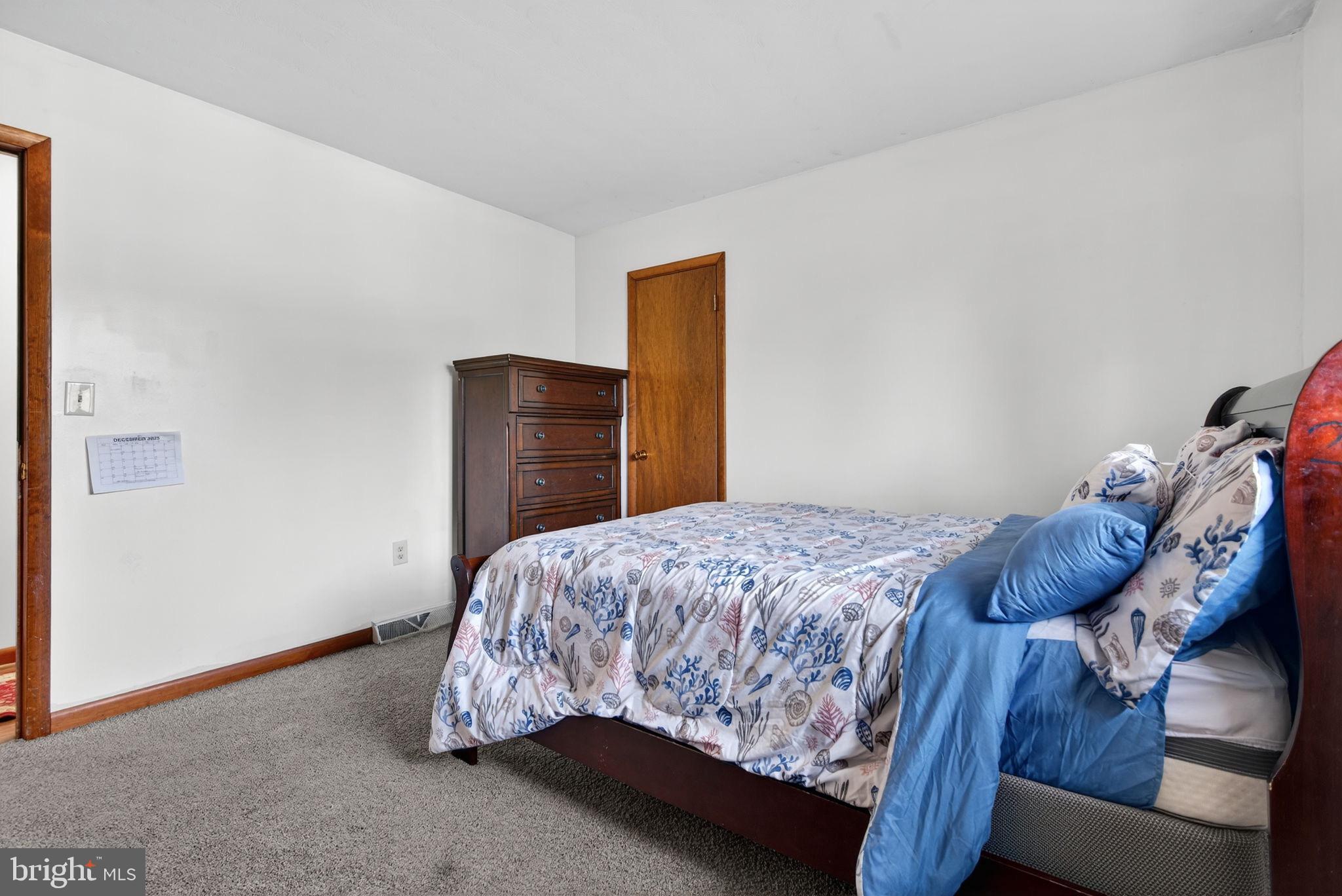 2210 Berkshire Road Lancaster, PA 17603 - Photo 43 of 68 a bedroom with a bed and wooden floor