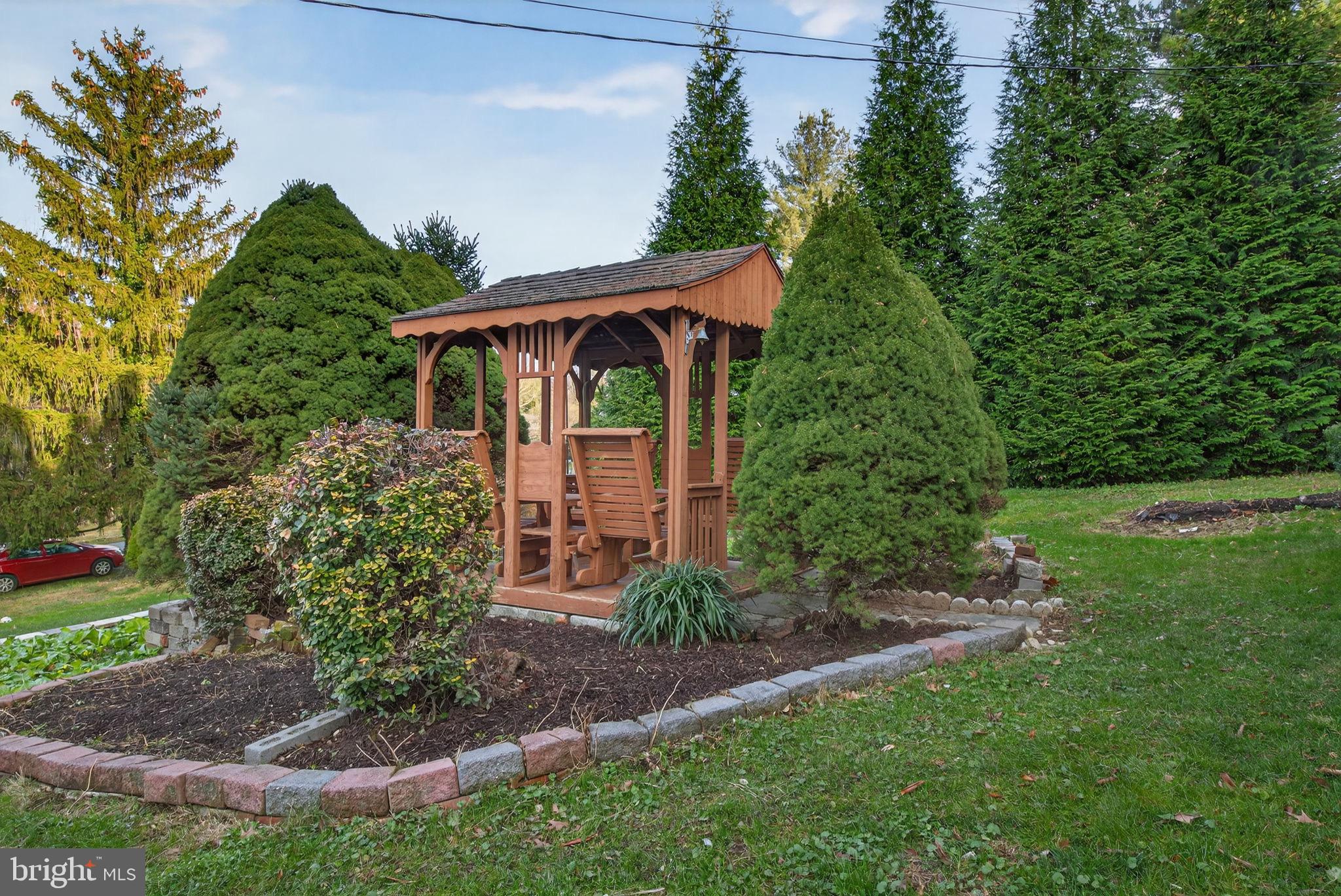2210 Berkshire Road Lancaster, PA 17603 - Photo 49 of 68 a view of a backyard with plants and large trees