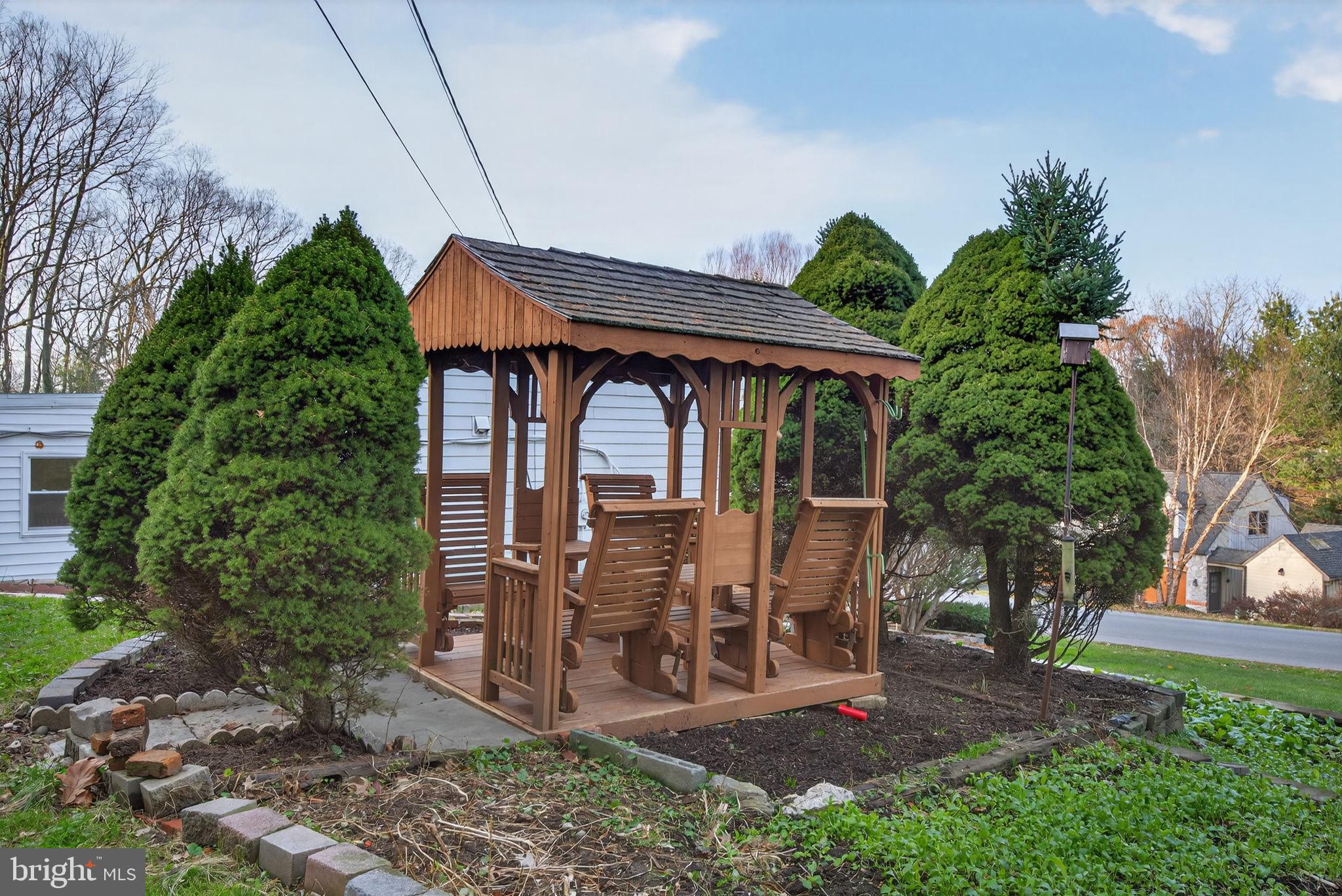 2210 Berkshire Road Lancaster, PA 17603 - Photo 51 of 68 Charming gazebo nestled among lush greenery.