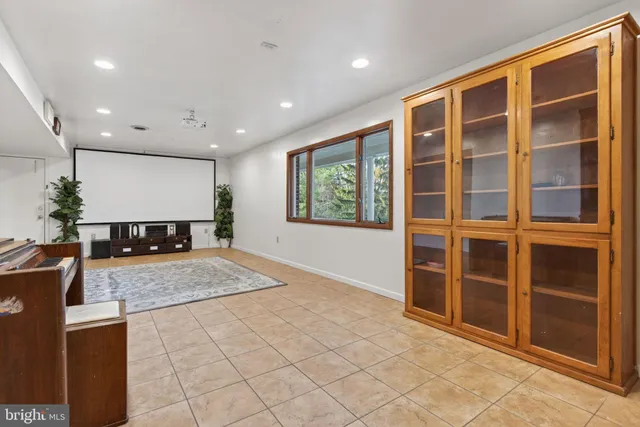 a view of living room with furniture and window