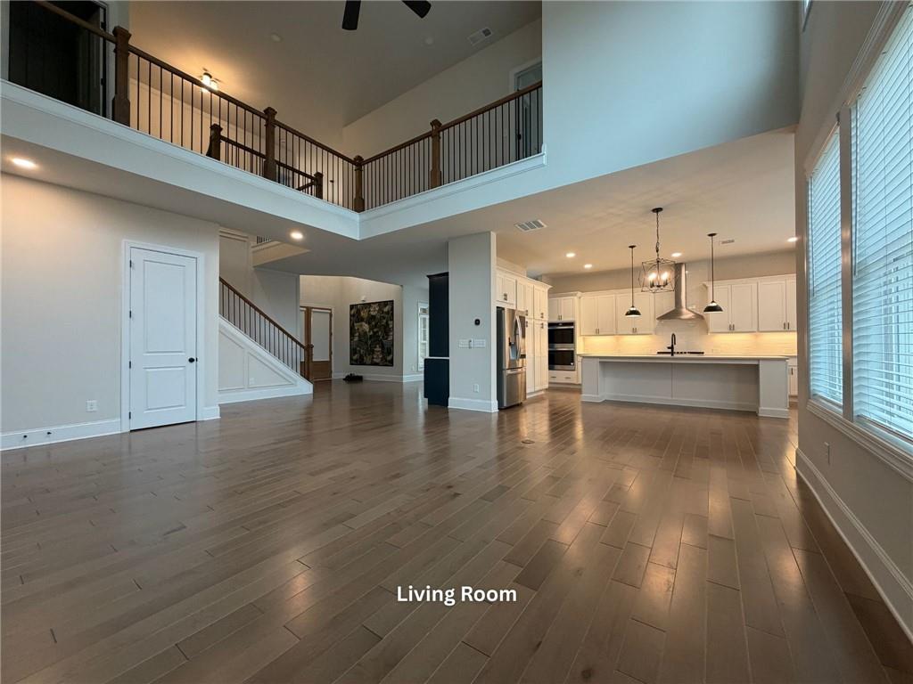 3770 Andover Street Cumming, GA 30028 - Photo 17 of 52 a view of large kitchen with granite countertop a large counter top and stainless steel appliances