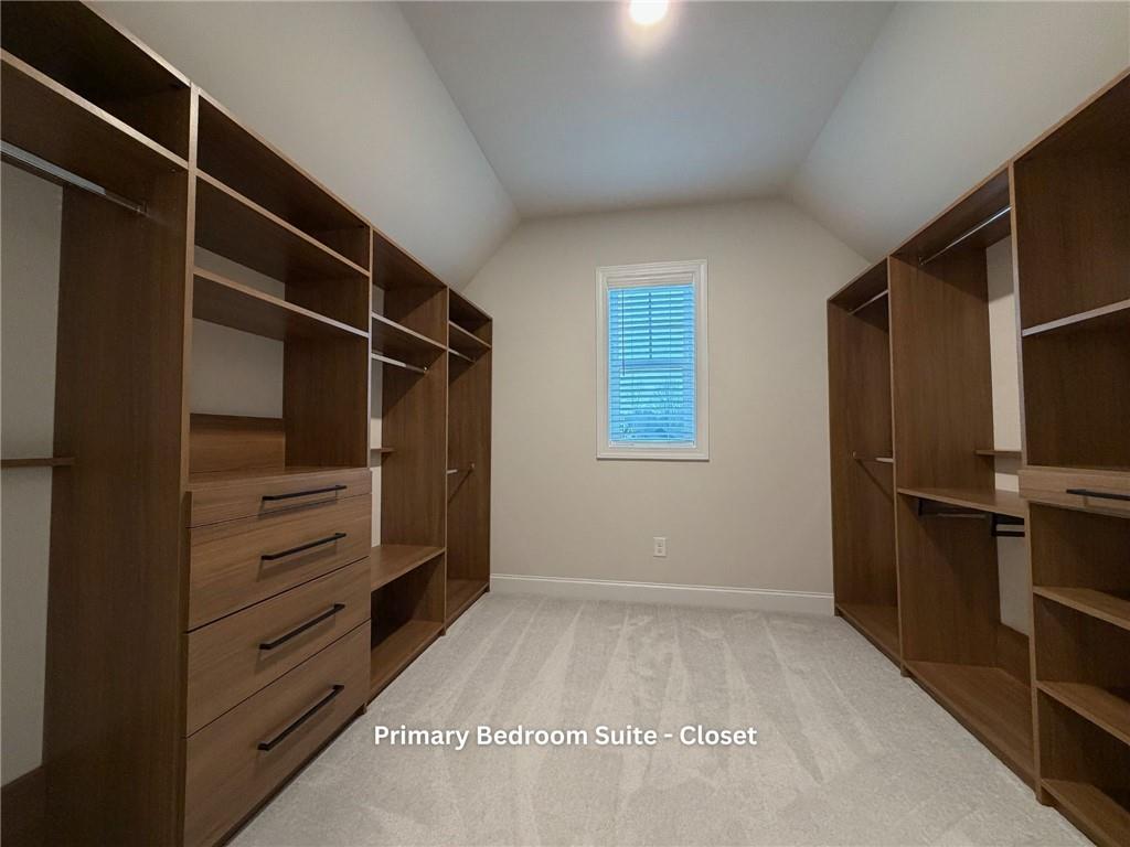 3770 Andover Street Cumming, GA 30028 - Photo 27 of 52 a view of walk in closet with empty racks
