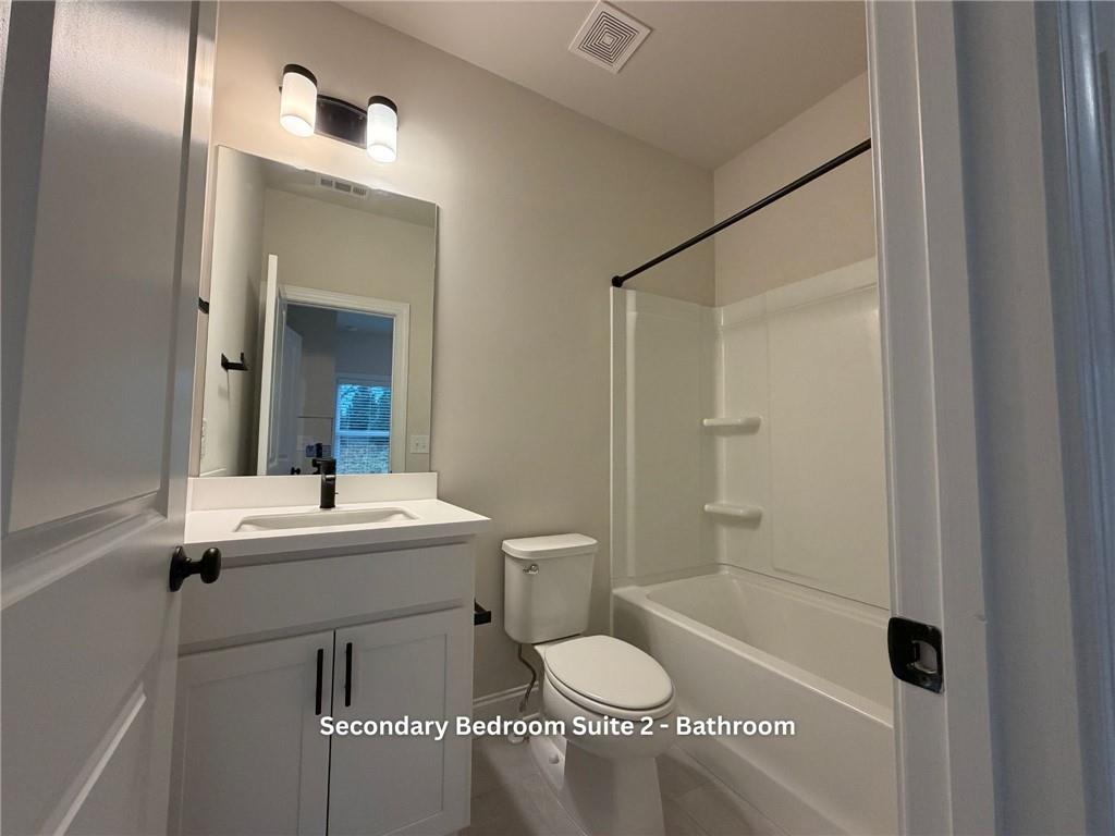 3770 Andover Street Cumming, GA 30028 - Photo 34 of 52 a bathroom with a sink a toilet and shower