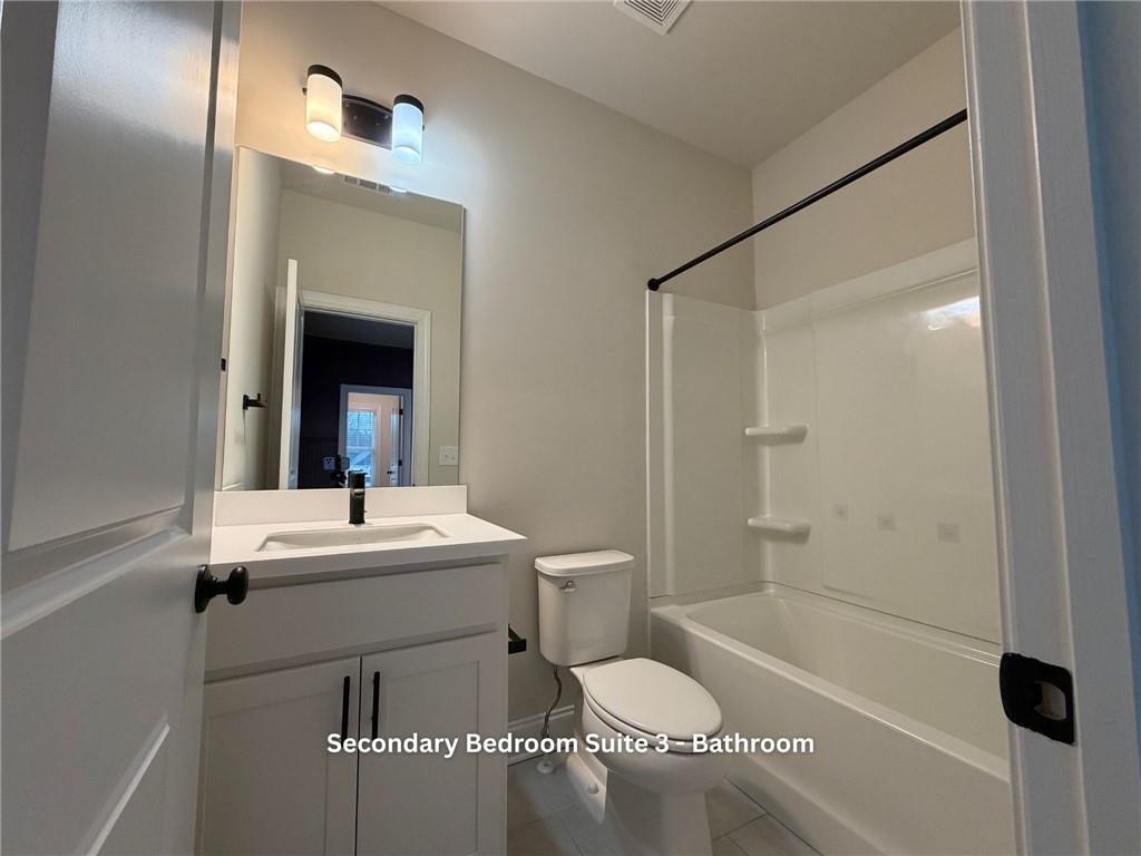 3770 Andover Street Cumming, GA 30028 - Photo 38 of 52 a bathroom with a sink a toilet and shower