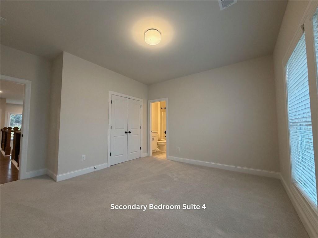 3770 Andover Street Cumming, GA 30028 - Photo 42 of 52 an empty room with closet and windows