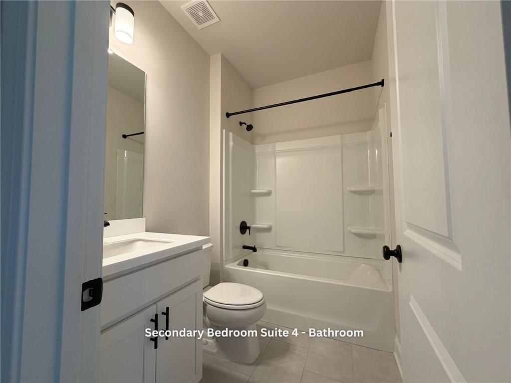 3770 Andover Street Cumming, GA 30028 - Photo 43 of 52 a bathroom with a bathtub shower sink vanity and a toilet