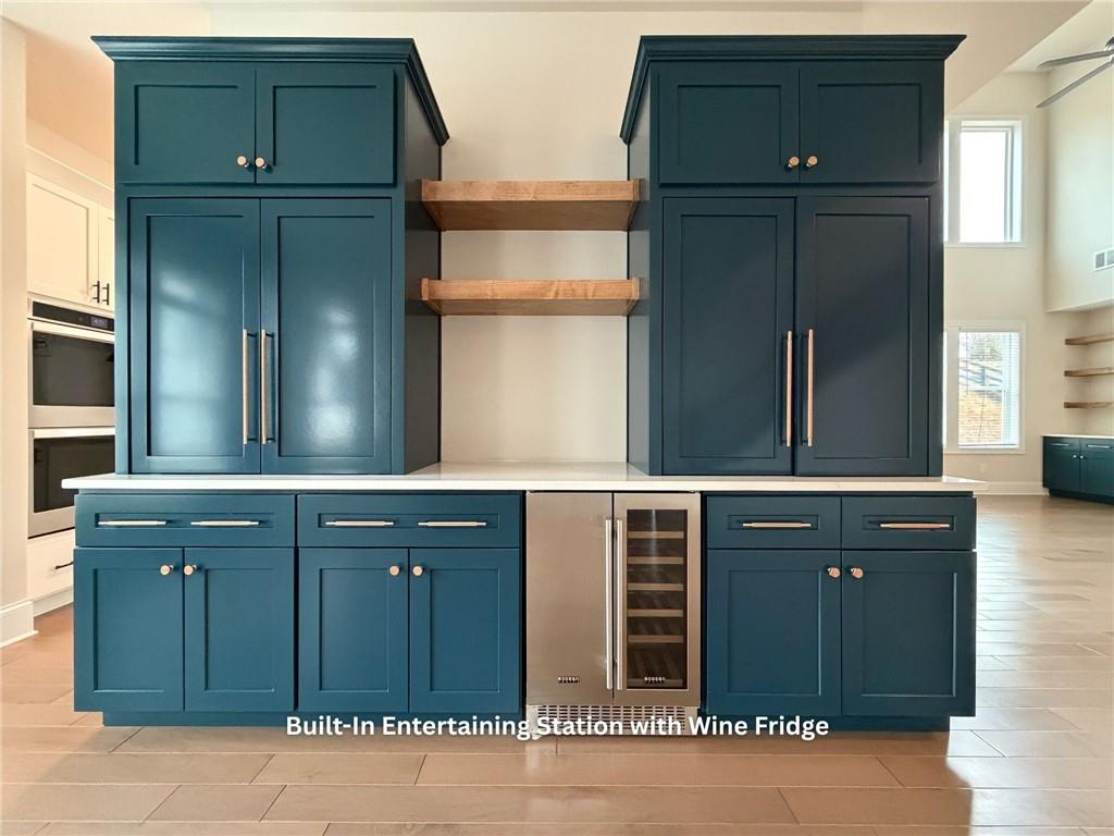 3770 Andover Street Cumming, GA 30028 - Photo 5 of 52 a kitchen with a cabinets and a refrigerator