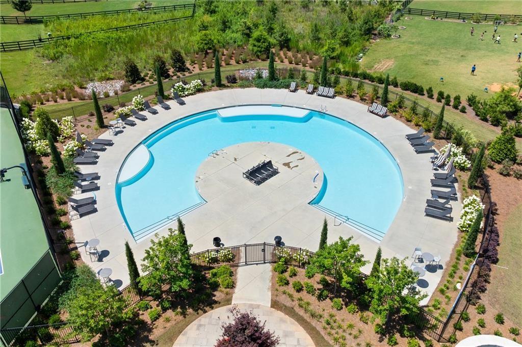 3770 Andover Street Cumming, GA 30028 - Photo 51 of 52 an aerial view of a swimming pool with outdoor seating and yard
