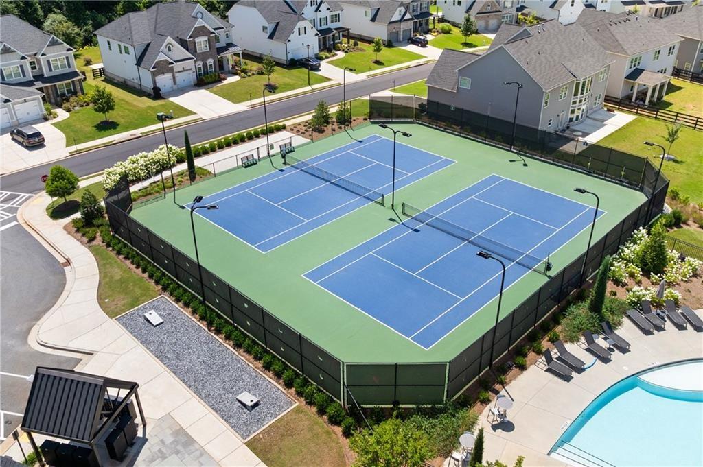 3770 Andover Street Cumming, GA 30028 - Photo 52 of 52 an aerial view of a tennis ground with large trees