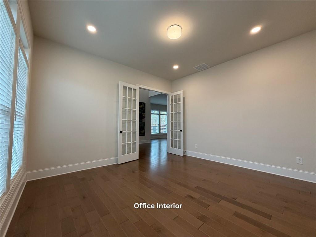 3770 Andover Street Cumming, GA 30028 - Photo 8 of 52 an empty room with wooden floor and windows