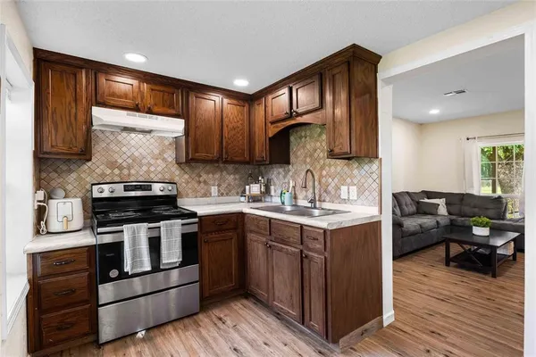 a kitchen with a stove and a sink