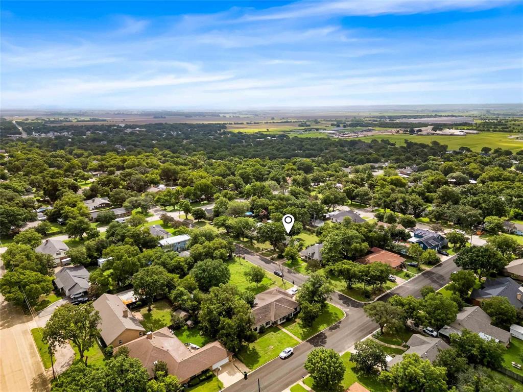 1126 West 7th Street McGregor, TX 76657 - Photo 32 of 33 an aerial view of residential houses with outdoor space and trees