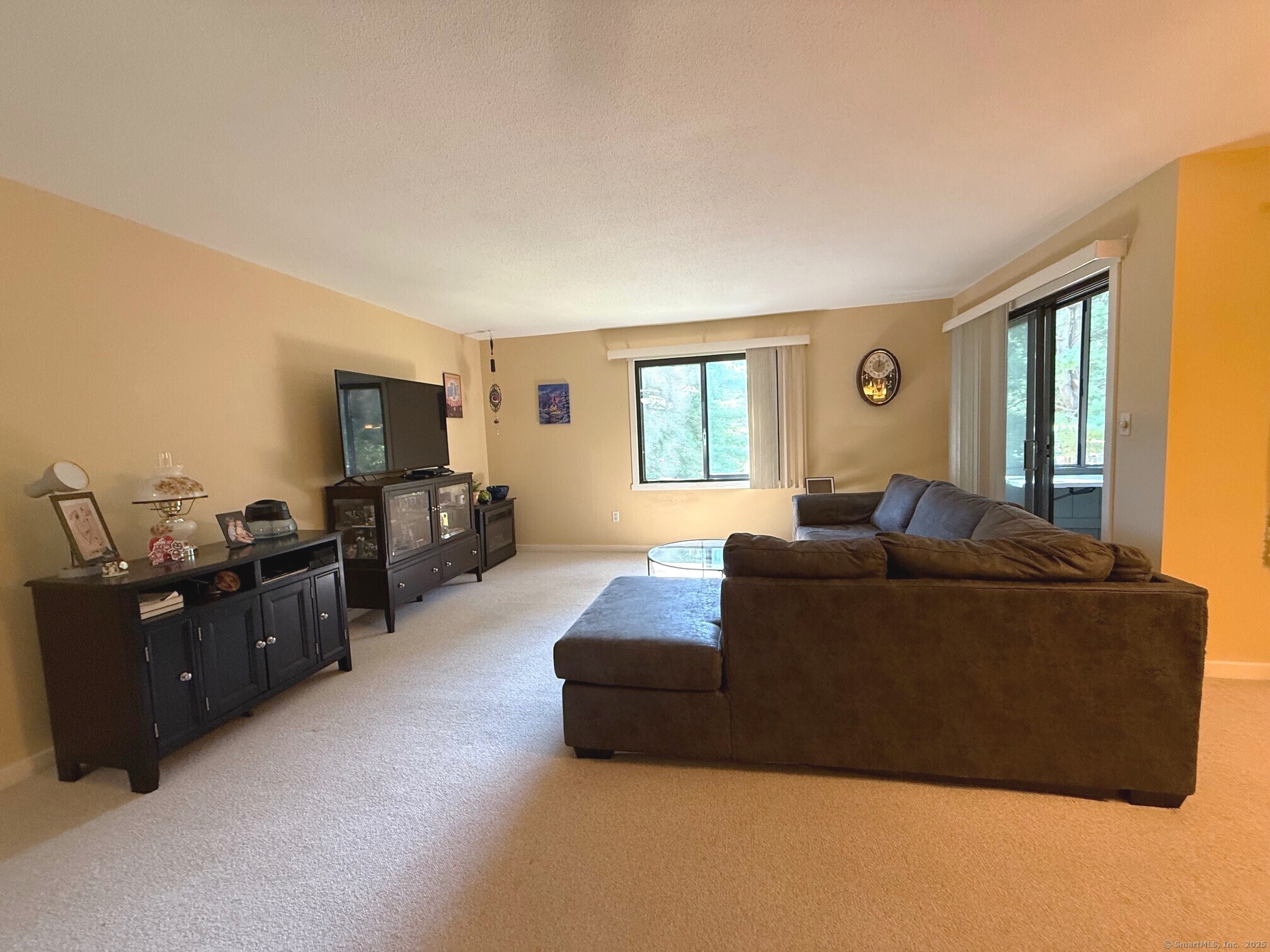 17 Hickory Hill Road, Unit 17 Southington, CT 06489 - Photo 1 of 1 a living room with furniture and a flat screen tv