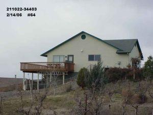 700 Bagley Road Granger, WA 98932 - Photo 1 of 5 a backyard of a house with garden and deck