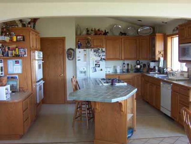 2762 Cook Road Yakima, WA 98908 - Photo 7 of 7 a kitchen with stainless steel appliances granite countertop a sink a stove and a refrigerator