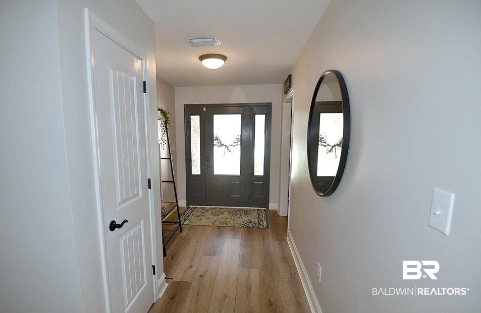 11201 Herschel Loop Daphne, AL 36526 - Photo 2 of 32 Doorway with light wood-type flooring