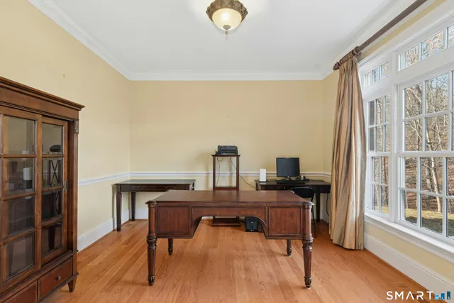 a workspace with furniture and window