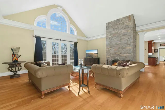 a living room with furniture and a fireplace