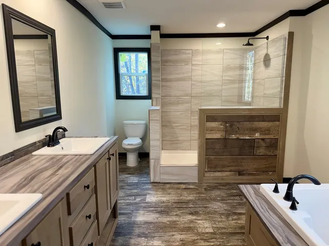 a bathroom with a sink a mirror and a shower