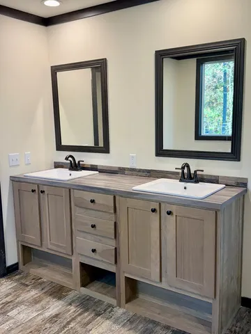 a bathroom with a double vanity sink and mirror