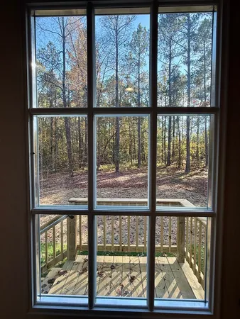 a view of a room with large windows