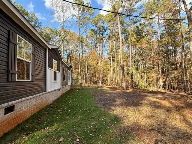a backyard of a house with lots of green space