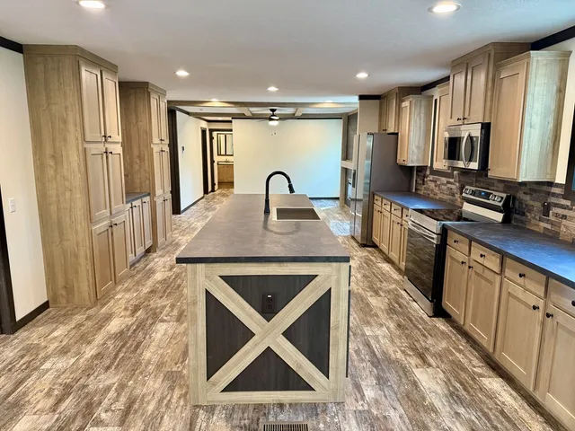 a kitchen with sink cabinets and window