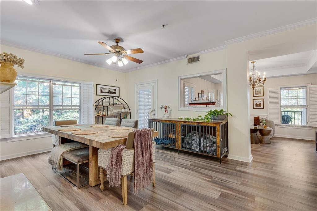 3275 Lenox Road Northeast, Unit 108 Atlanta, GA 30324 - Photo 2 of 22 a view of a dining room with furniture window and wooden floor