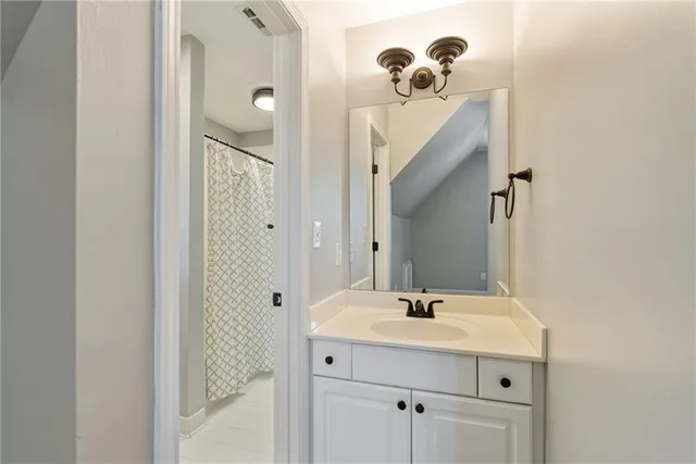 a view of washer and dryer with kitchen in the background