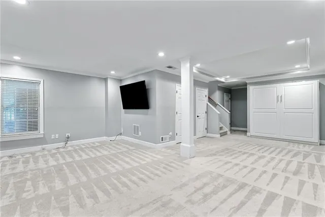 a view of an empty room with a flat screen tv