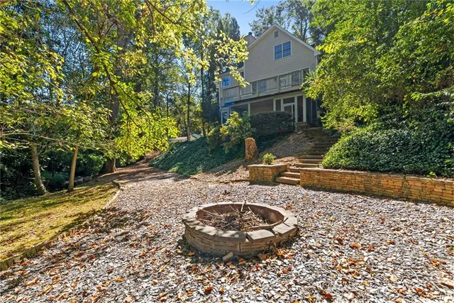 a view of yard with large trees