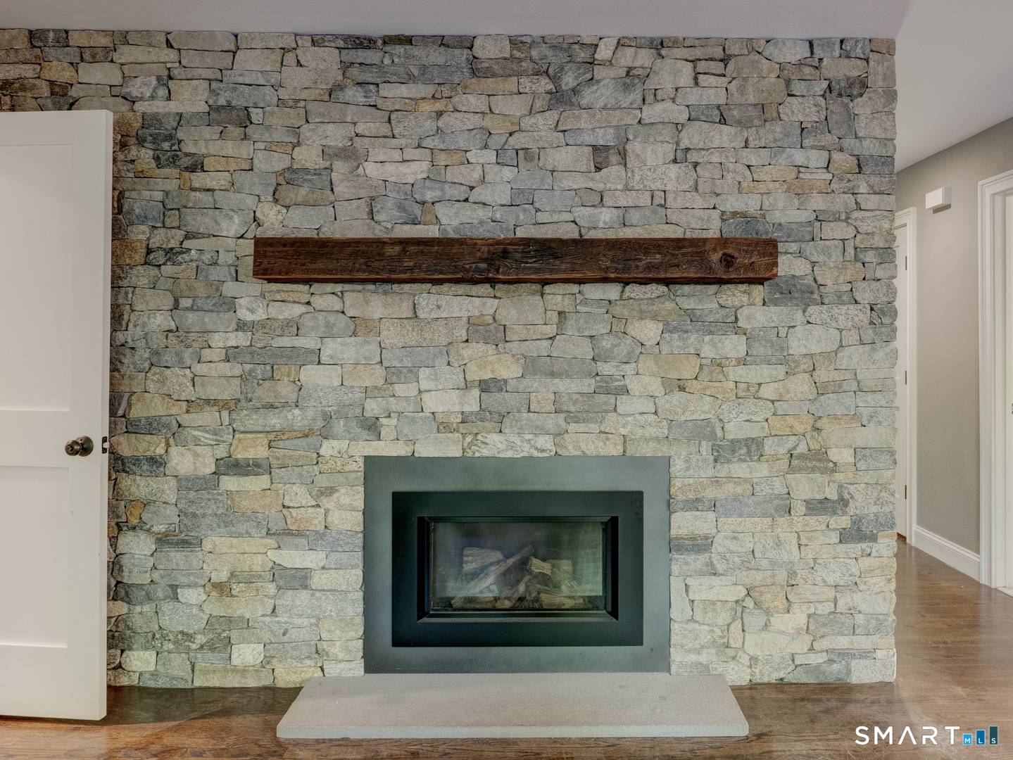 198 Summer Hill Road Madison, CT 06443 - Photo 9 of 22 The propane fireplace in the family room off the kitchen