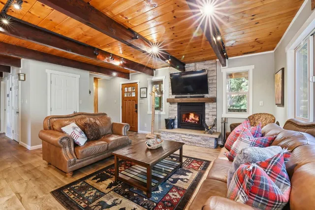 a living room with furniture fireplace and a flat screen tv