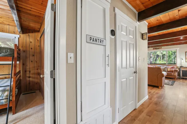 a bathroom with a toilet a sink and a large mirror