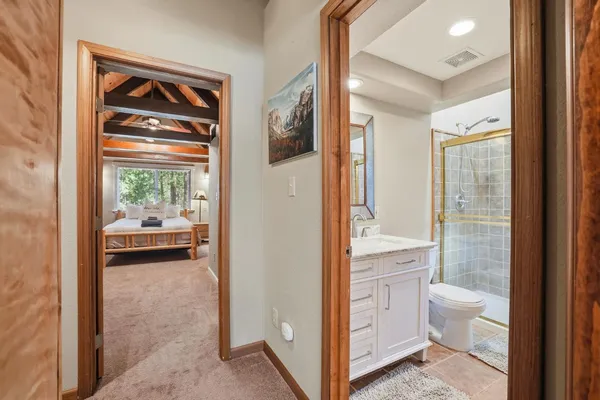 a bedroom with furniture and a large window