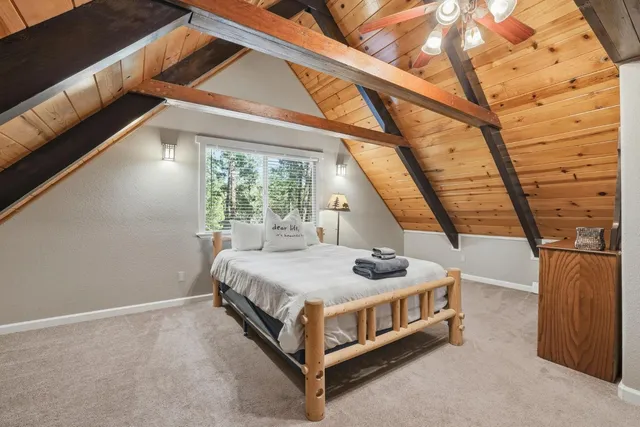 a room with furniture pool table and windows