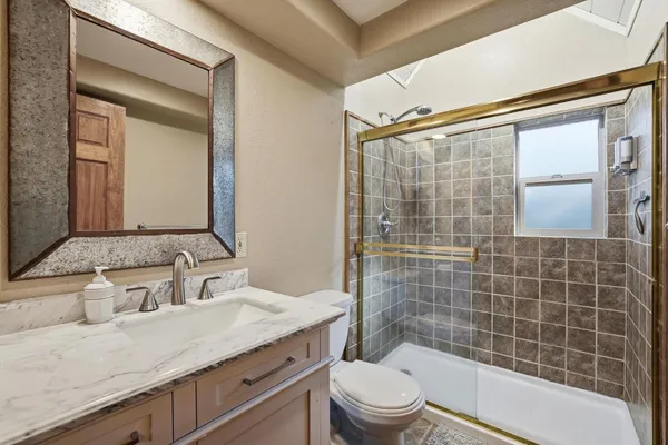 a view of a room with wooden floor and workspace